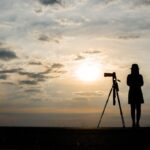 A girl with a standing camera