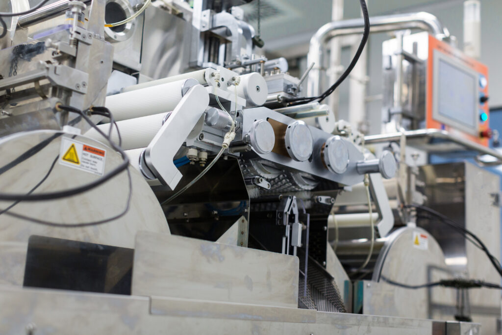 big-steel-chromed-manufacture-machine-with-shafts-computer-control-panel-from-bellow-1024x683 How to Choose the Right Injection Molding Machine Manufacturers