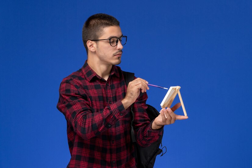 front-view-male-student-red-checkered-shirt-with-backpack-drawing-easel-blue-wall_140725-42460 Unlocking the Mysteries of Further Maths and Its Real-World Applications