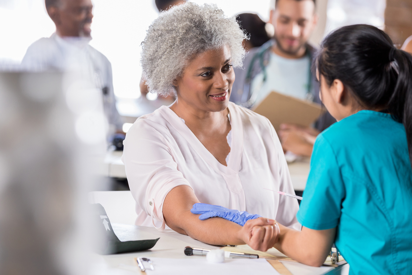 Senior woman receiving flu vaccine