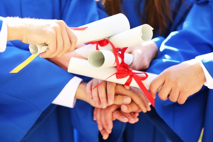 graduate-students-with-diplomas-closeup_392895-203913