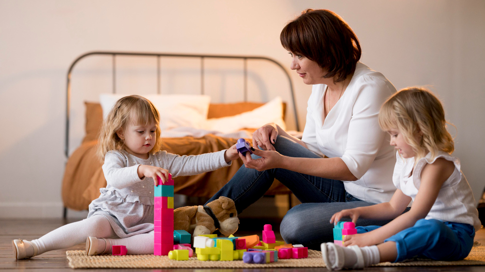 child care worker taking care of children