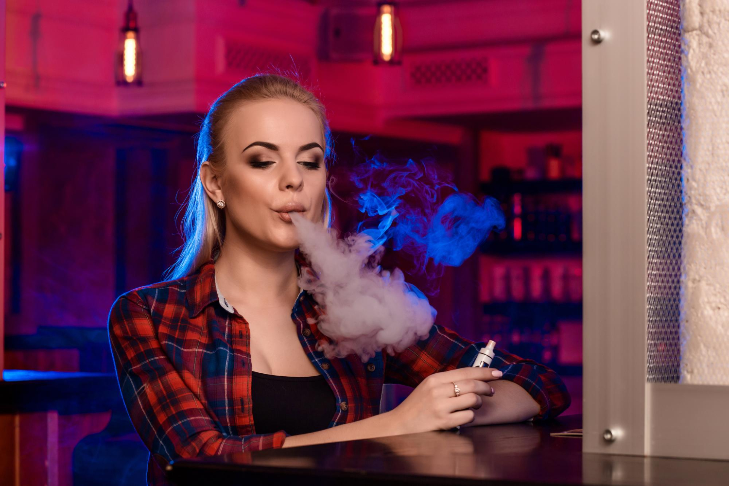 a girl smoking vape