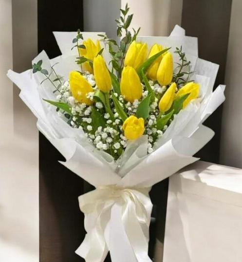 A vibrant bouquet of yellow tulips, symbolizing hope and cheer, perfect for a get well soon gesture.