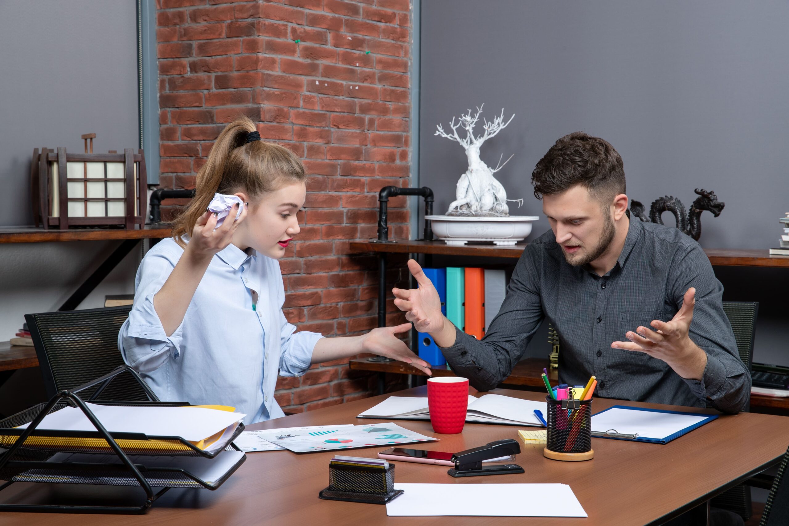 Small business owner reviewing financial statements with a bookkeeper