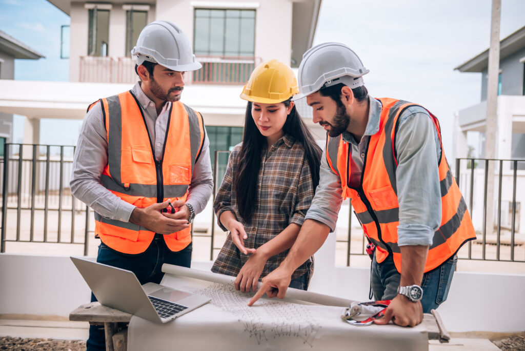 civil-engineer-construction-worker-architects-wearing-hardhats-safety-vests-are-working-together-construction-site-building-home-cooperation-teamwork-concept-1024x684 Top Premier General Contractors in Woodstock, NB for Quality Construction