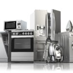A group of modern stainless steel home appliances including a dishwasher, microwave, oven, refrigerator, washing machine, vacuum cleaner, and iron, representing a complete smart kitchen and laundry setup