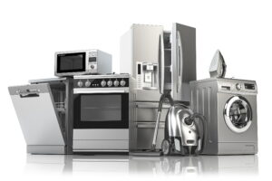 A group of modern stainless steel home appliances including a dishwasher, microwave, oven, refrigerator, washing machine, vacuum cleaner, and iron, representing a complete smart kitchen and laundry setup