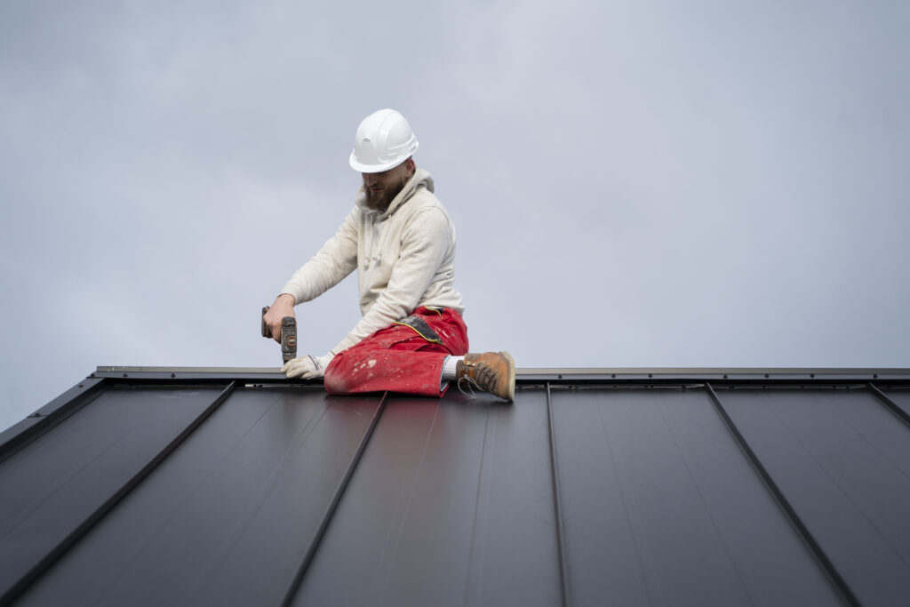 man-working-with-protection-helm-1024x683 Affordable Roofing Repair Moncure | Apex Roofing NC