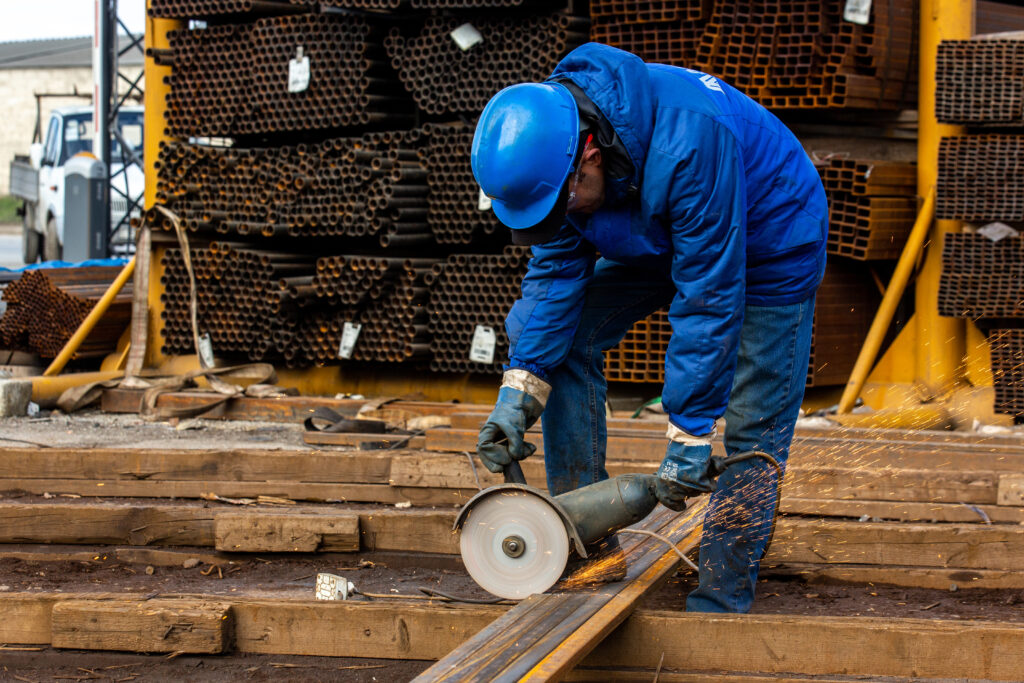 worker-cuts-iron-with-tool-1024x683 Reliable Deck Services Portland – Cedar Mill Deck Company